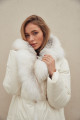 Women's long white down jacket with natural filler and fox fur decoration