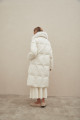 Women's long white down jacket with natural filler and fox fur decoration