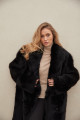 Long sheepskin coat made of natural black cashmere lamb