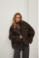 Short two-sided sheepskin coat made of natural sheepskin in coffee color