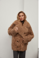 Stylish two-sided sheepskin coat made of natural sheepskin in camel color