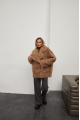 Stylish two-sided sheepskin coat made of natural sheepskin in camel color