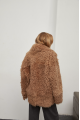 Stylish two-sided sheepskin coat made of natural sheepskin in camel color