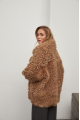 Stylish two-sided sheepskin coat made of natural sheepskin in camel color