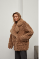 Stylish two-sided sheepskin coat made of natural sheepskin in camel color