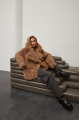 Stylish two-sided sheepskin coat made of natural sheepskin in camel color