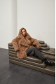 Stylish two-sided sheepskin coat made of natural sheepskin in camel color