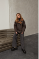 A stylish chocolate-colored sheepskin coat made of natural sheepskin in the VINTAGE style