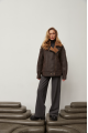 A stylish chocolate-colored sheepskin coat made of natural sheepskin in the VINTAGE style