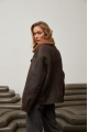 A stylish chocolate-colored sheepskin coat made of natural sheepskin in the VINTAGE style