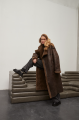 Stylish long sheepskin coat made of natural chocolate-colored sheepskin in VINTAGE style