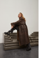 Stylish long sheepskin coat made of natural chocolate-colored sheepskin in VINTAGE style