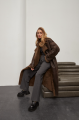 Stylish long sheepskin coat made of natural chocolate-colored sheepskin in VINTAGE style