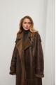 Stylish long sheepskin coat made of natural chocolate-colored sheepskin in VINTAGE style