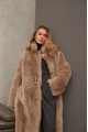 Long sheepskin coat made of natural cashmere lamb in brown color