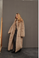 Long sheepskin coat made of natural cashmere lamb in brown color