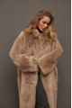 Long sheepskin coat made of natural cashmere lamb in brown color