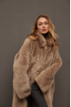 Long sheepskin coat made of natural cashmere lamb in brown color