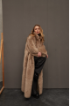 Long sheepskin coat made of natural cashmere lamb in brown color