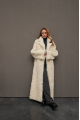 Long curly two-sided sheepskin coat of white color made of natural sheepskin in OVERSIZE style