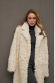 Long curly two-sided sheepskin coat of white color made of natural sheepskin in OVERSIZE style