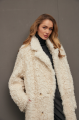 Long curly two-sided sheepskin coat of white color made of natural sheepskin in OVERSIZE style