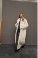 Long curly two-sided sheepskin coat of white color made of natural sheepskin in OVERSIZE style