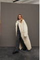 Long curly two-sided sheepskin coat of white color made of natural sheepskin in OVERSIZE style