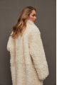 Long curly two-sided sheepskin coat of white color made of natural sheepskin in OVERSIZE style