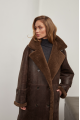 A stylish sheepskin coat made of natural chocolate-colored sheepskin in the VINTAGE style