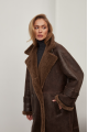 A stylish sheepskin coat made of natural chocolate-colored sheepskin in the VINTAGE style