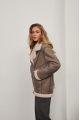 Stylish women's sheepskin coat made of gray natural sheepskin in VINTAGE style