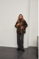 A stylish chocolate-colored sheepskin coat made of natural sheepskin