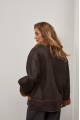 A stylish chocolate-colored sheepskin coat made of natural sheepskin