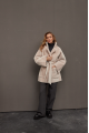 Stylish sheepskin coat in the OVERSIZE style made of natural cream-colored sheepskin