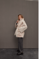 Stylish sheepskin coat in the OVERSIZE style made of natural cream-colored sheepskin