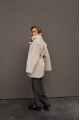 Stylish sheepskin coat in the OVERSIZE style made of natural cream-colored sheepskin