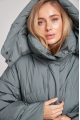 Stylish short down jacket of green color with natural filling