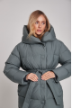 Long down jacket of green color with natural filling