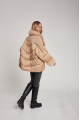 Women's down jacket of beige color with mink fur and decorative knitting and natural filler