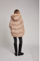 Stylish women's down jacket of beige color with cashmere lamb fur and natural filler