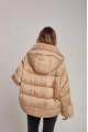 Women's down jacket of beige color with cashmere lamb fur and natural filling