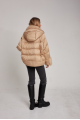 Women's down jacket of beige color with cashmere lamb fur and natural filling