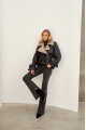 A stylish sheepskin coat made of natural black sheepskin in VINTAGE style