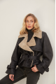 A stylish sheepskin coat made of natural black sheepskin in VINTAGE style
