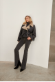 A stylish sheepskin coat made of natural black sheepskin in VINTAGE style