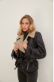 A stylish sheepskin coat made of natural black sheepskin in VINTAGE style