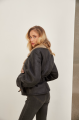 A stylish sheepskin coat made of natural black sheepskin in VINTAGE style