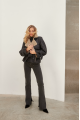 A stylish sheepskin coat made of natural black sheepskin in VINTAGE style