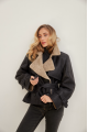 A stylish sheepskin coat made of natural black sheepskin in VINTAGE style